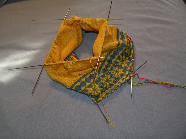 All on needles and ready to knit together with brim sts